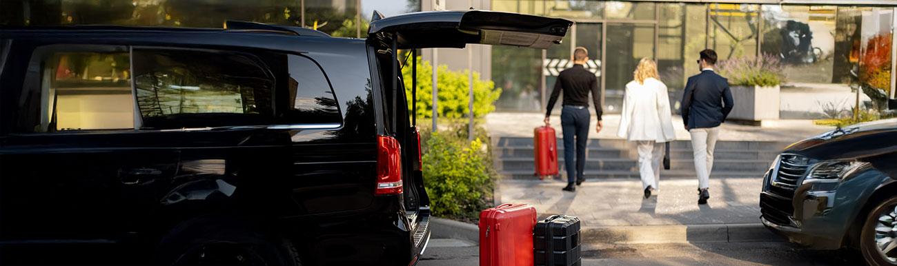Hotel guest transfer — SUV at hotel with luggage